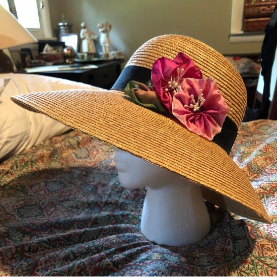 Straw hat with pink silk rosette cocka